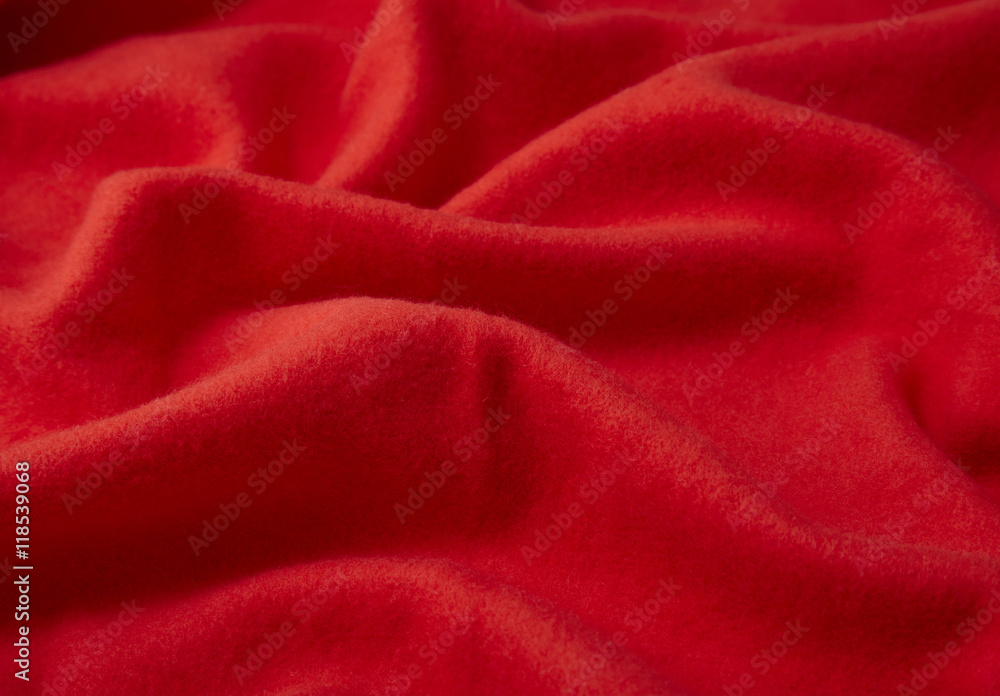 A full page close up of red fleece material texture A full page close up of red fleece material texture