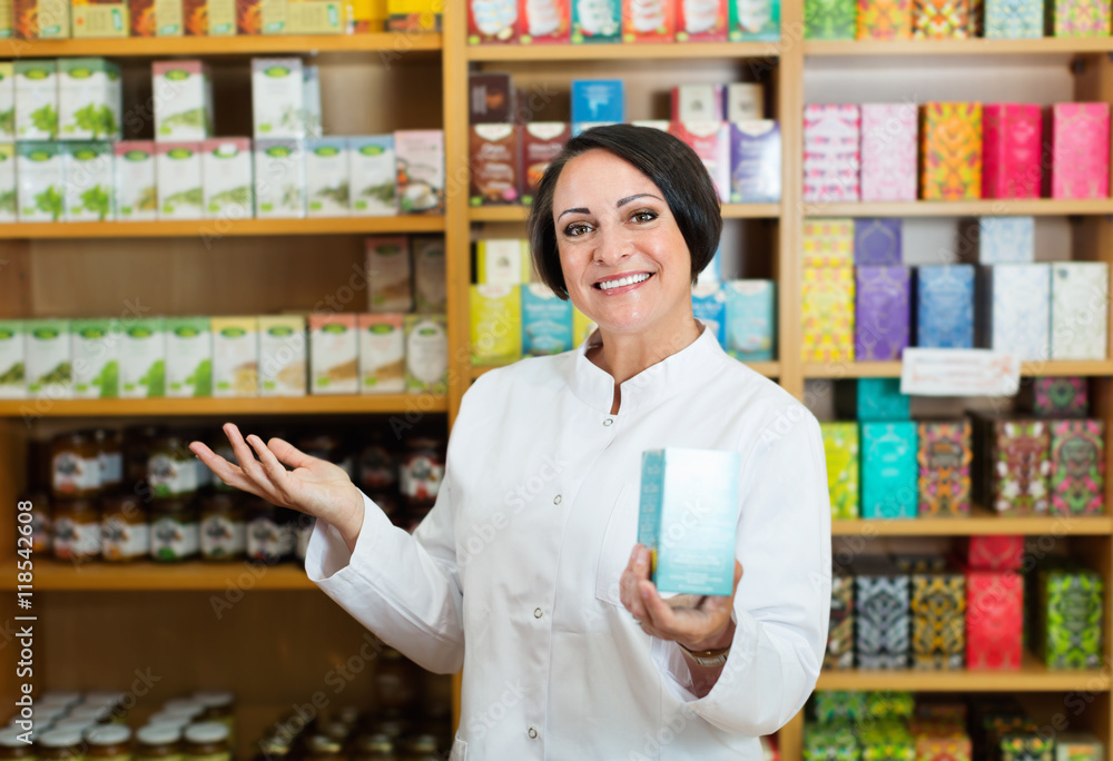 Woman in white coat promoting food additive goods in carton in d