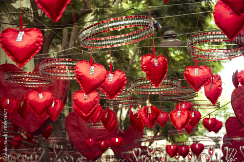 Red hearts hanging and moving in Gracia district  Barcelona