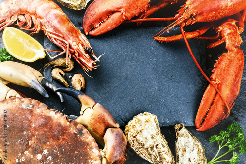 Food frame with crustacean for dinner. Lobster, crab, jumbo shri