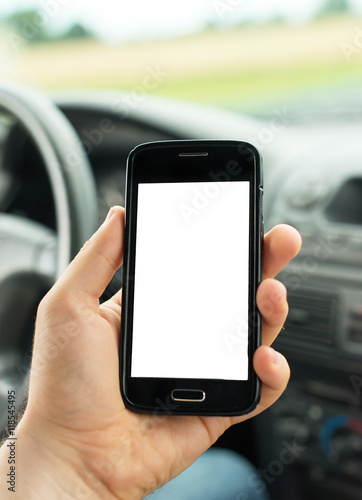 Man using mobile phone in car. Blank screen for your text.