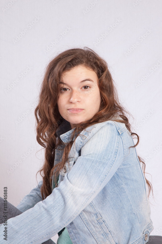 Lovely woman looking thoughtfully over her shoulder Lovely woman looking thoughtfully over her shoulder