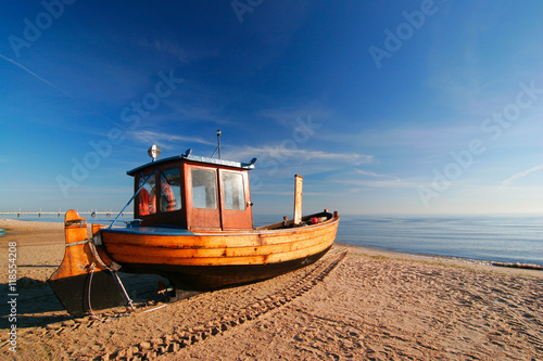 Fishing Boat on Sand Beach, Warm Light of the Rising Sun, Usedom Island, Germany 
