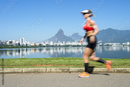 Athletic Brazilian woman jogging at Lagoa Rodrigo de Freitas lagoon, Rio de Janeiro, Brazil