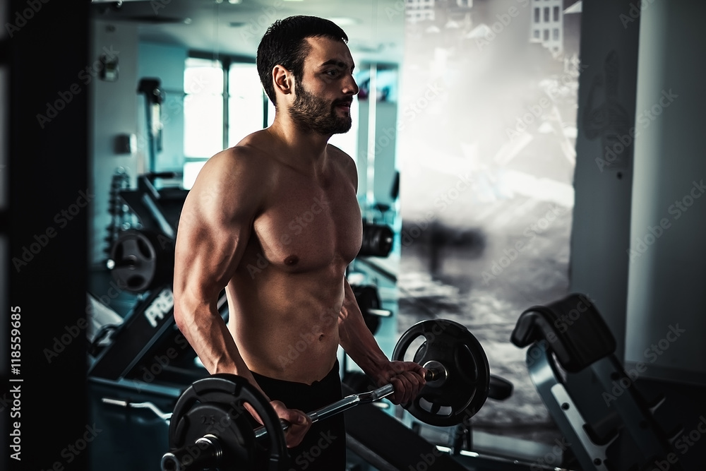 Man workout biceps with barbell Man workout biceps with barbell