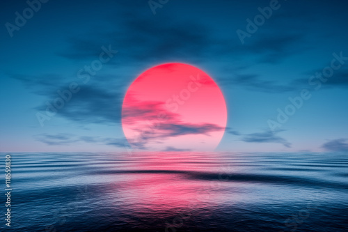 a red sunset over the blue sea