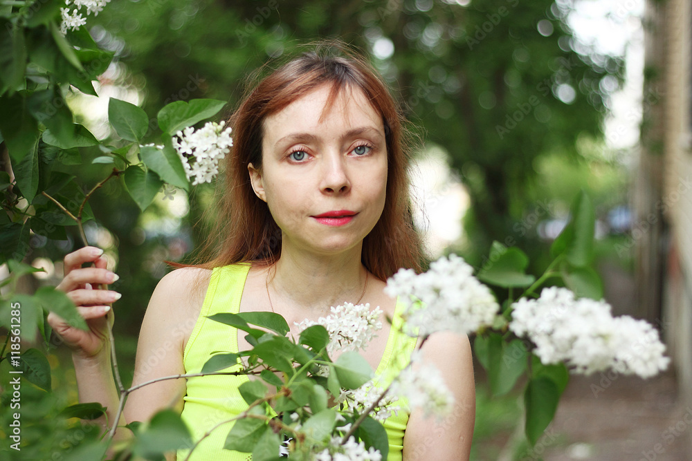 Beautiful summer portrait of a girl with a lilac flowers. Beautiful summer portrait of a girl with a lilac flowers.