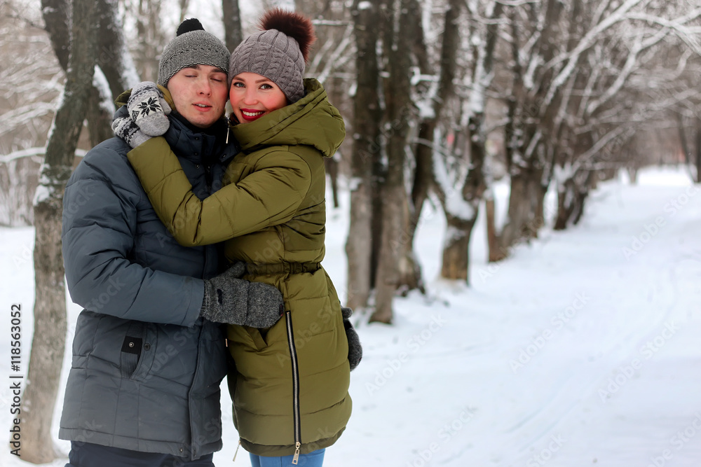 Fototapeta premium young lovers walk smile winter