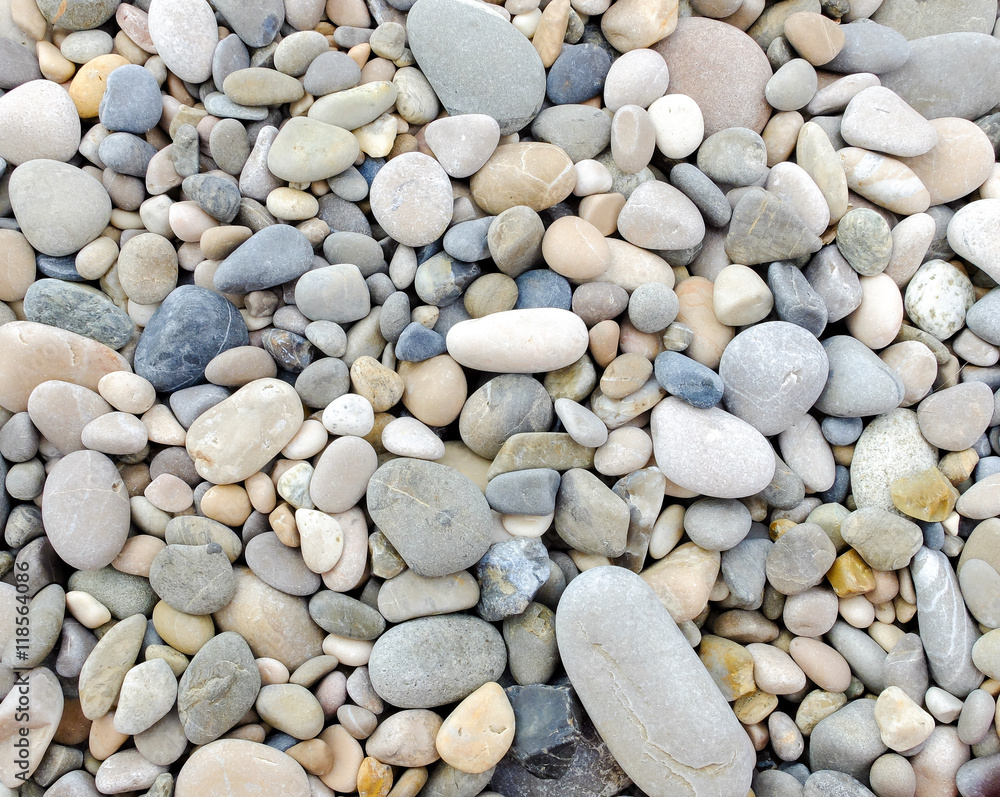 Small pebbles on the beach create pattern, gray tones Small pebbles on the beach create pattern, gray tones
