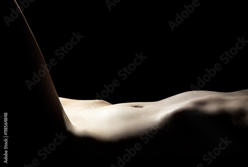 Fototapeta Young woman's naked belly