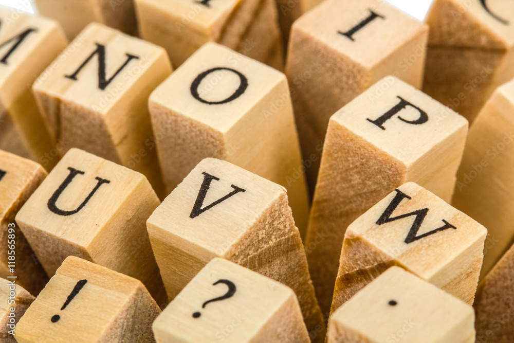 Letters of the English alphabet on the ends of wooden bars Letters of the English alphabet on the ends of wooden bars