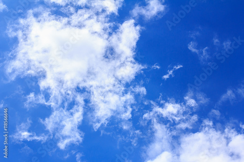 Blue sky with white clouds. The vast blue sky and clouds sky on sunny day. White fluffy clouds in the blue sky.