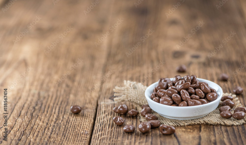 Old wooden table with Chocolate Raisins Old wooden table with Chocolate Raisins