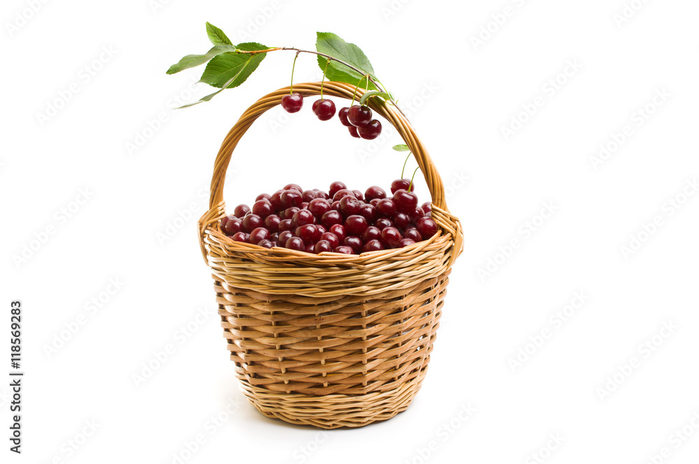 Basket full of fresh red cherry on a white background Basket full of fresh red cherry on a white background