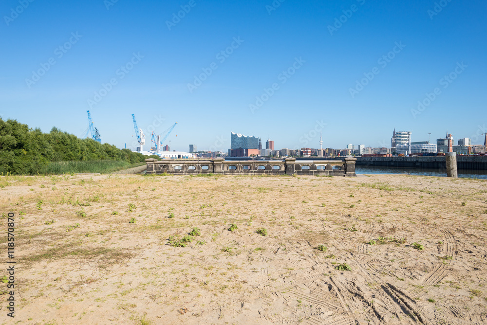 Industrial area in the harbor of Hamburg. View point to the other side of the Elbe river, the Elbphilharmonie and the brand new district Hafencity