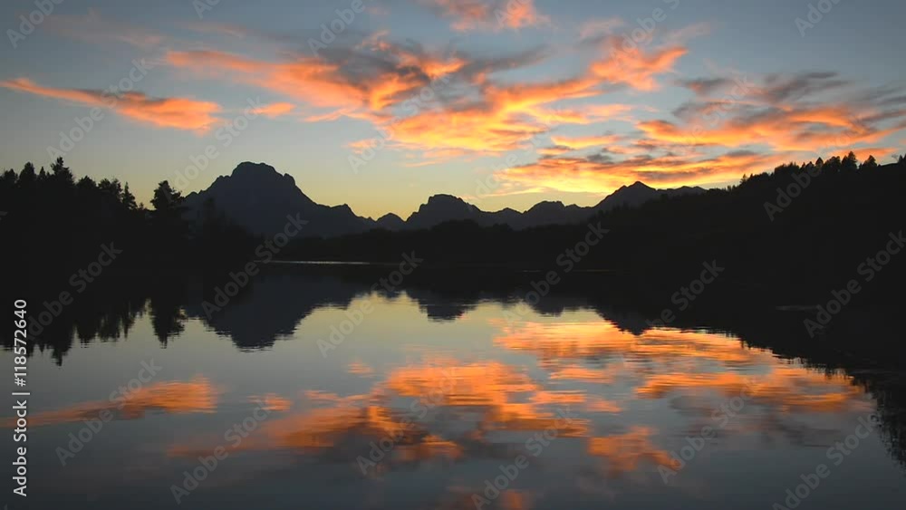 Beautiful sunset reflected in the Snake River in Grand Teton National Park Beautiful sunset reflected in the Snake River in Grand Teton National Park