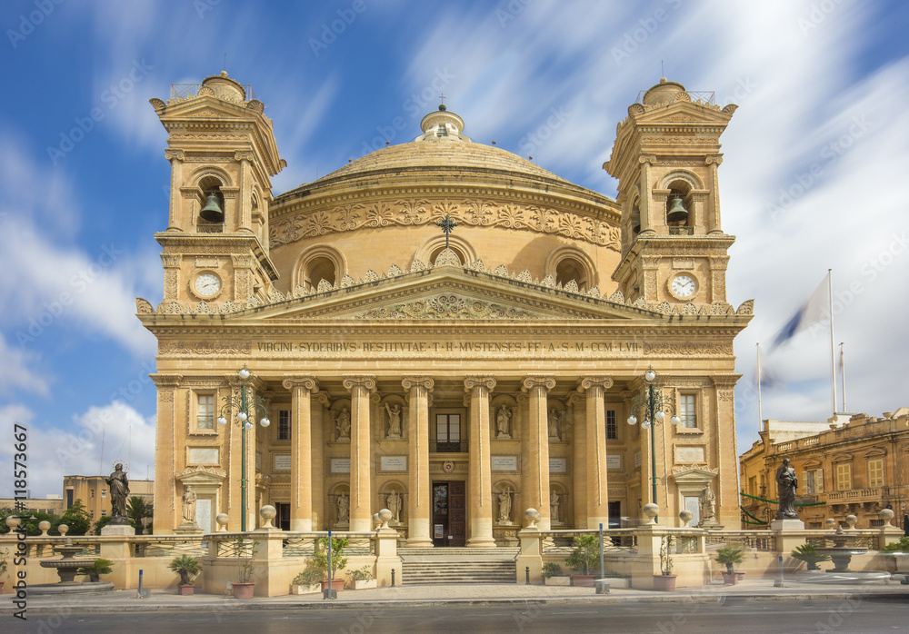 Mosta, Malta - The Church of Assumption of our Lady also know as Mosta Dome at daylight with moving clouds