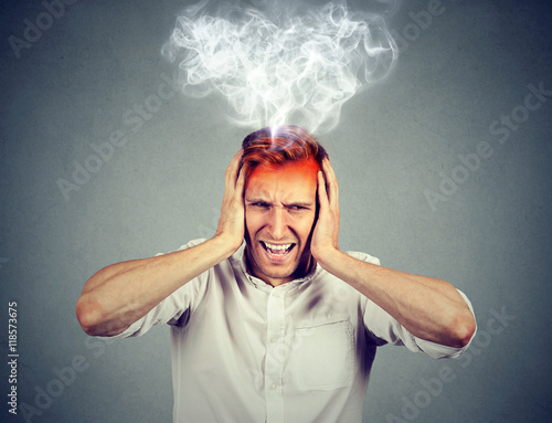 stressed man screaming overwhelmed steam coming out up of head photo