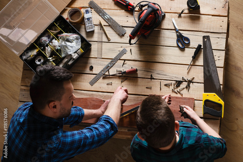 construction of father and son in the garage, family concept vie