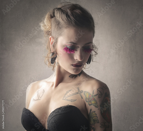 Sensual tattooed woman photo