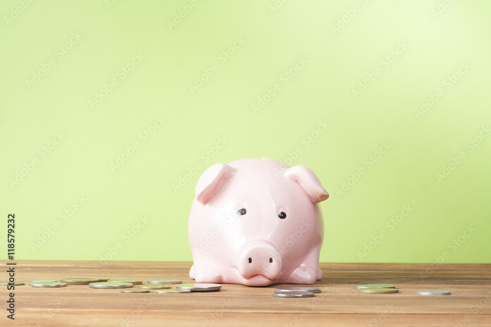 Home savings, budget concept. Model house, notepad, pen, calculator and coins on wooden office desk table. Home savings, budget concept. Model house, notepad, pen, calculator and coins on wooden office desk table.