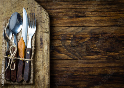 Autumn Halloween composition. Rustic set of cutlery knife, spoon, fork.