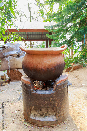Wallpaper Mural decocting medicinal herbs with earthen pot
 Torontodigital.ca