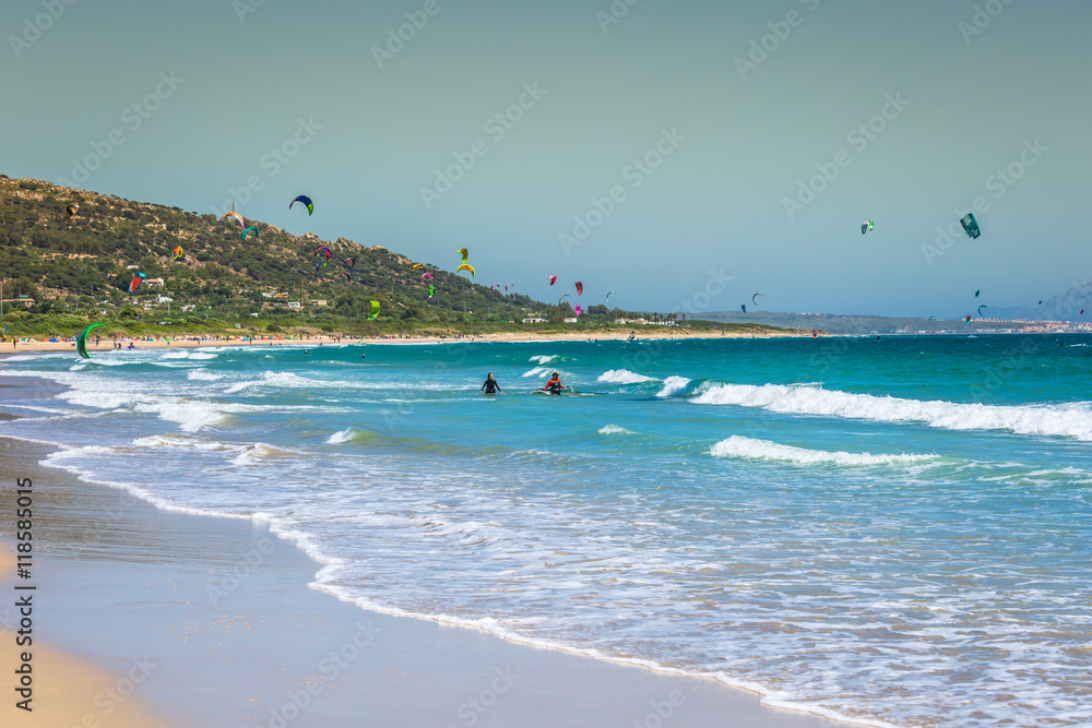 Tarifa,Spain-May 15,2015:kites flying over Tarifa beach - obrazy, fototapety, plakaty 