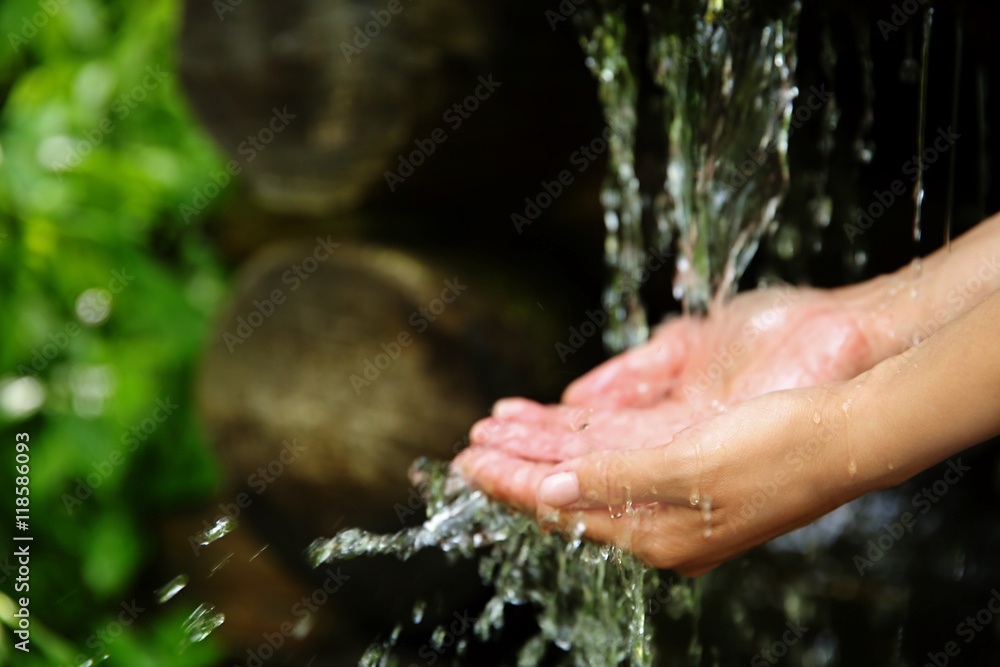 © Africa Studio - Woman pouring water in hands