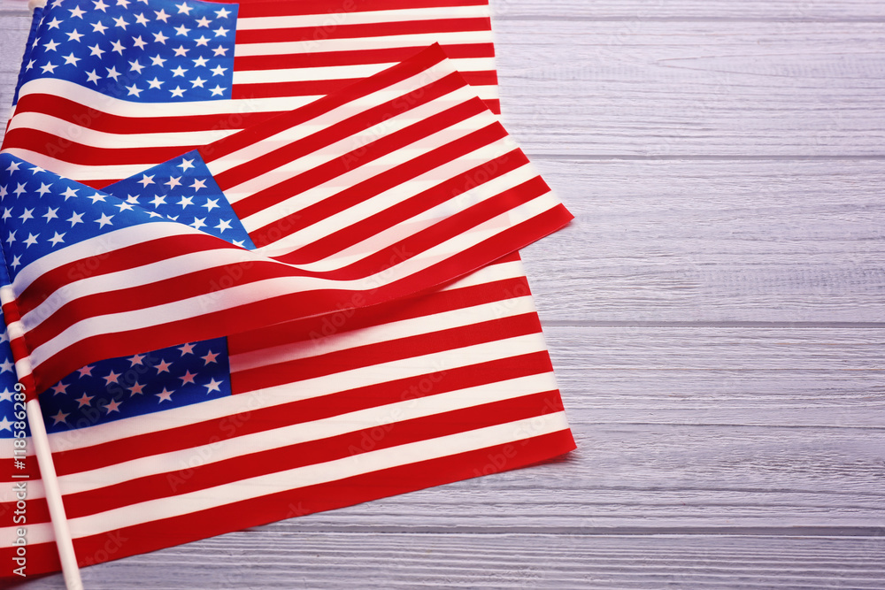 Obraz premium American flags on white wooden background