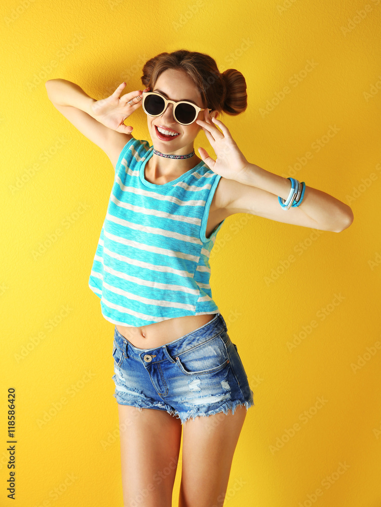 Beautiful girl on yellow background