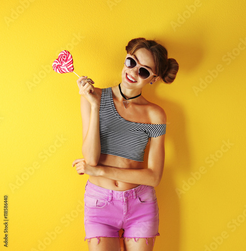 Beautiful girl with candy o...