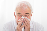 Man Infected With Cold Blowing His Nose