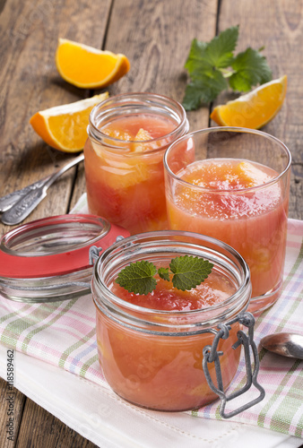 Citrus jelly in a glass jar.
