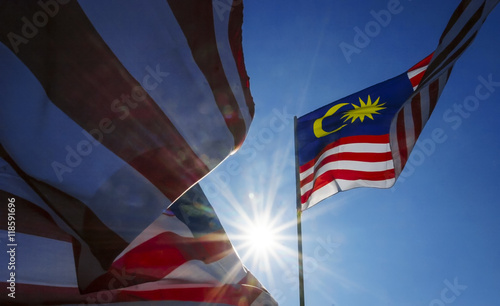 Malaysia flag also known as Jalur Gemilang wave with the blue sky. photo