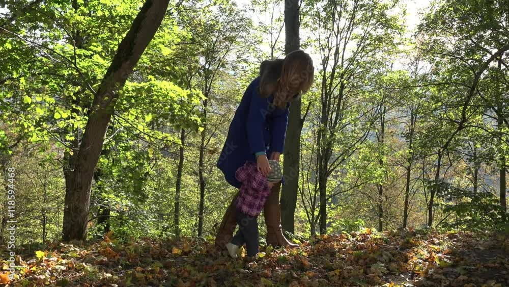 Woman teach baby child walking in autumn forest. 4K Woman teach baby child walking in autumn forest. 4K