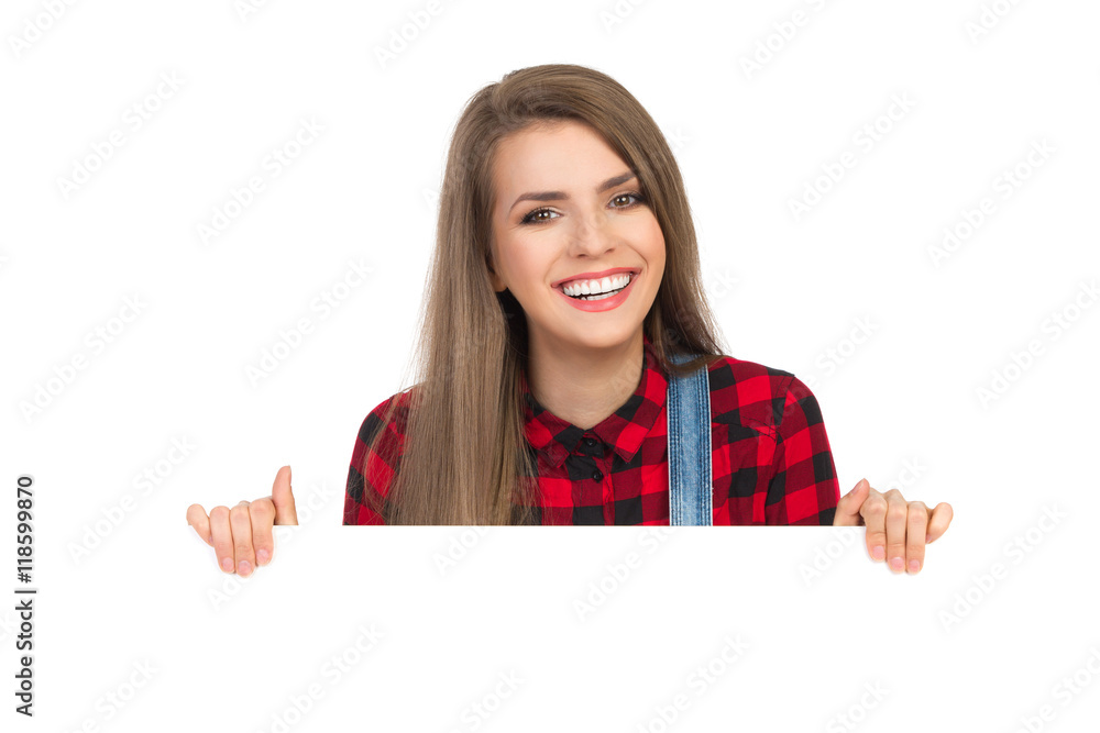 Smiling Girl In Lumberjack Shirt Behind White Placard Smiling Girl In Lumberjack Shirt Behind White Placard