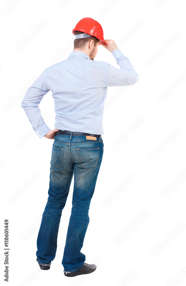 Backview of an engineer in construction helmet stands. Standing young guy. Rear view people collection. backside view of person. Isolated over white background. businessman in a white shirt and a Backview of an engineer in construction helmet stands. Standing young guy. Rear view people collection. backside view of person. Isolated over white background. businessman in a white shirt and a