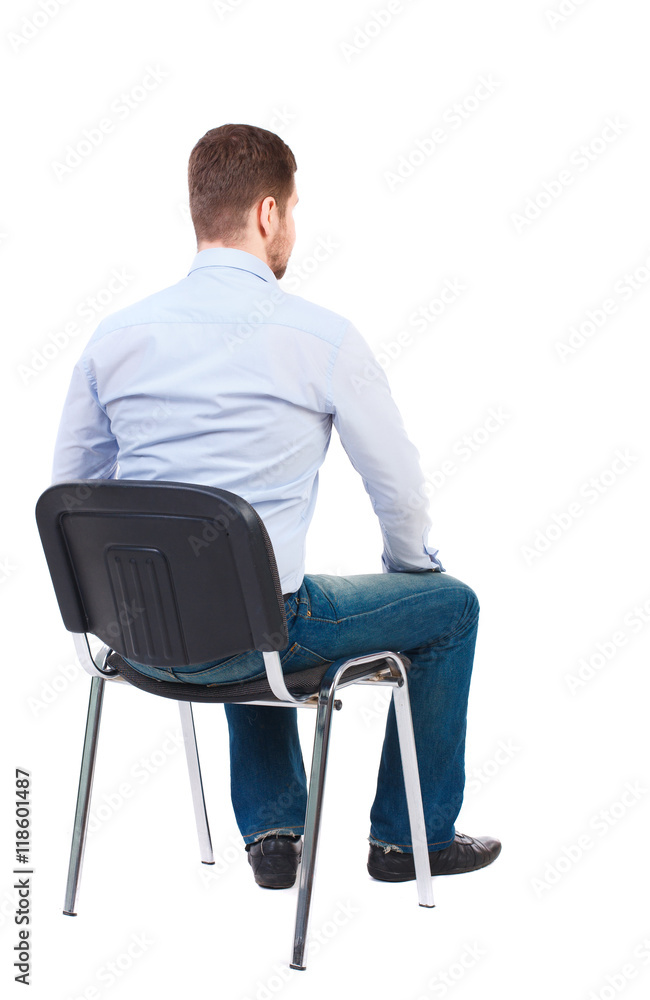 back view of business man sitting on chair.  businessman watching. Rear view people collection.  backside view of person.  Isolated over white background. Bearded businessman in white shirt sits on a