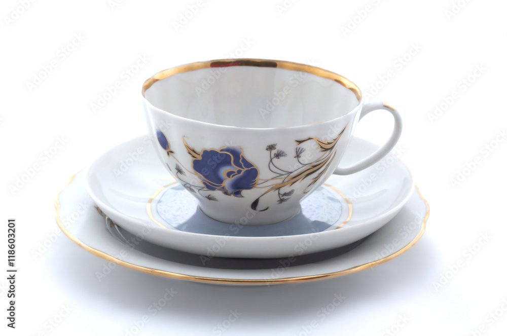 Porcelain cup, plate and saucer on a white background Porcelain cup, plate and saucer on a white background