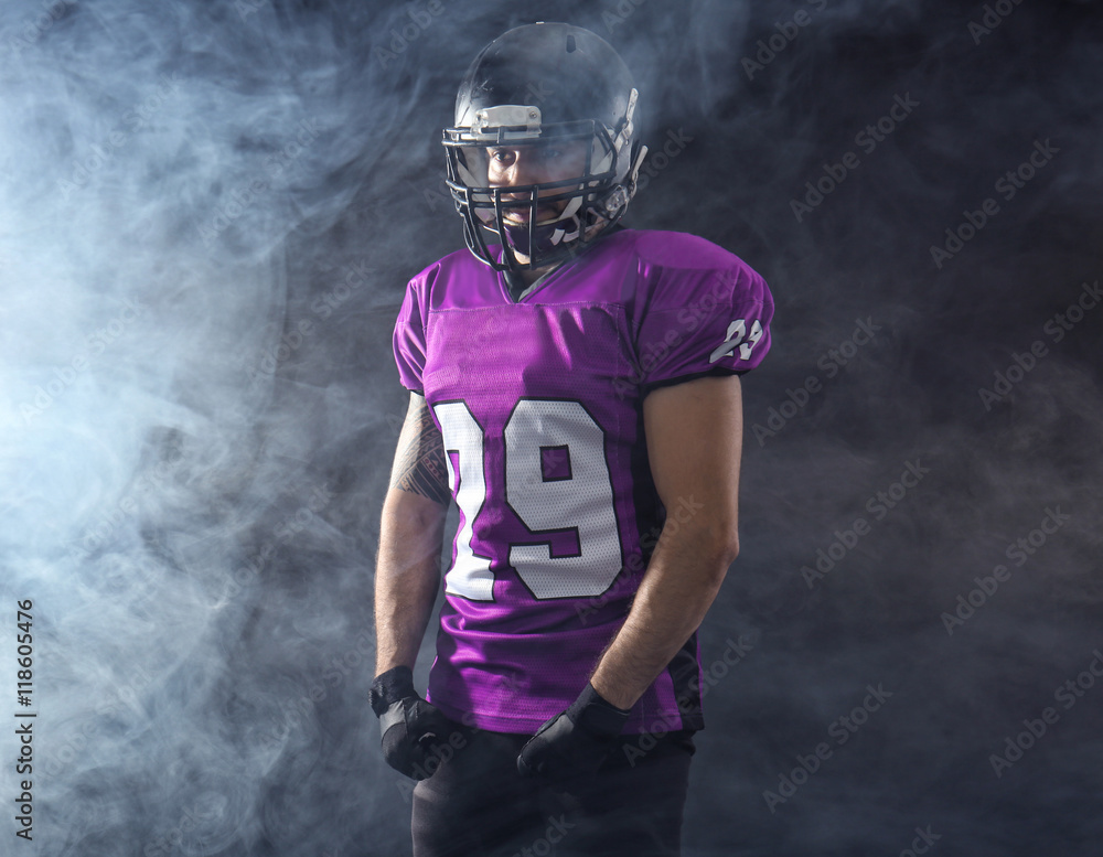 American football player on smoky background