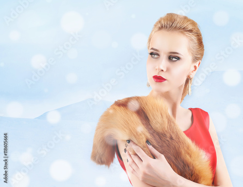 Elegant woman in fur cape o...