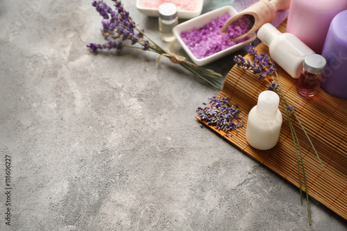 Spa composition with lavender and salt on gray background