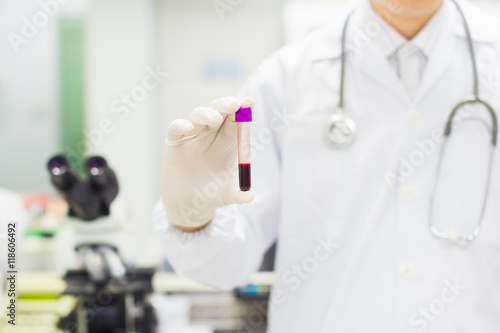 Medical technician holding Blood tube in laboratory.Picture for concept such as hospital doctor  health and science.