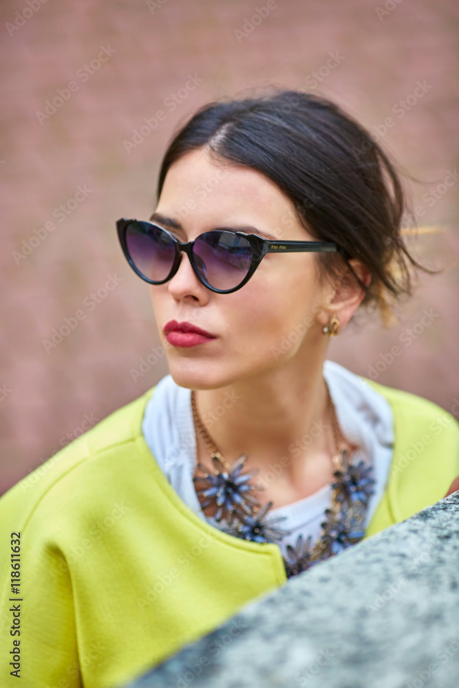 Capture of curvy face of a woman in foxy sunglasses Capture of curvy face of a woman in foxy sunglasses