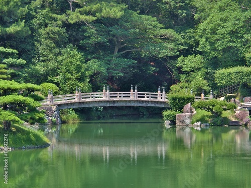 A wooden bridge in Ritsurin Garden in Takamatsu city  Kagawa Prefecture  Japan. Ritsurin Garden is one of the most famous historical gardens in Japan.