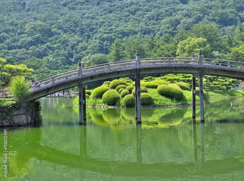 A wooden bridge - Engetsukyo in Ritsurin Garden in Takamatsu city, Kagawa Prefecture, Japan. Ritsurin Garden is one of the most famous historical gardens in Japan.