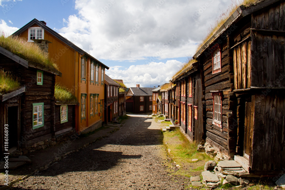 Street with traditional wooden houses in the historic Norwegian mining town Røros.