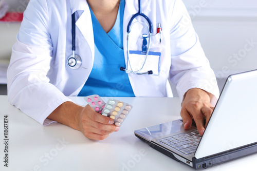 Wallpaper Mural the doctor writes a prescription pill on the computer Torontodigital.ca