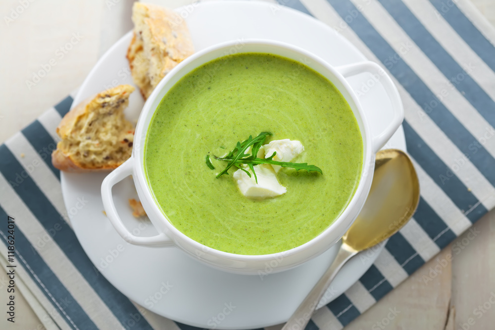 Delicious spinach cream soup with rye bread on a table. International meal. Top view. Delicious spinach cream soup with rye bread on a table. International meal. Top view.
